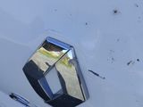 a close up of a car ' s emblem on the side of the car