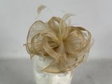 a hat with a flower on top of it on a mannequin head