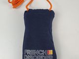 blue pouch with orange cord and french disorder logo on it