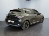 the rear end of a grey car in a showroom