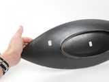 a person holding a large black object in their hand