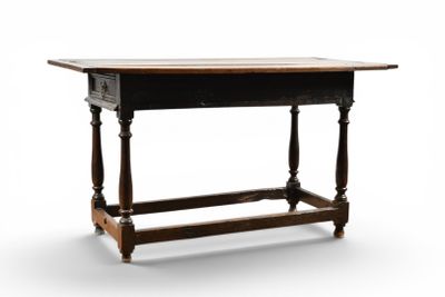 an old wooden table with a drawer on top of it