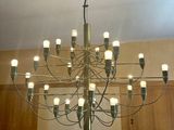 a large chandelier with many lights hanging from the ceiling