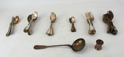 several spoons, forks, and spoon rest on a white surface