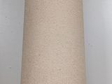 a tall vase with a chain around it on a table