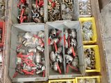 a box full of assorted metal parts on a table