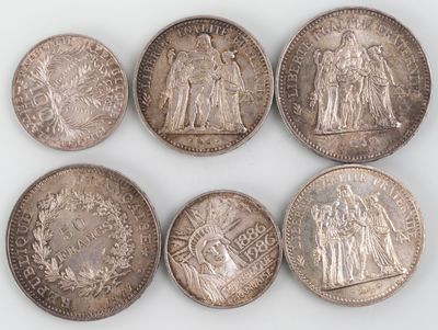 six different types of silver coins are shown on a white surface