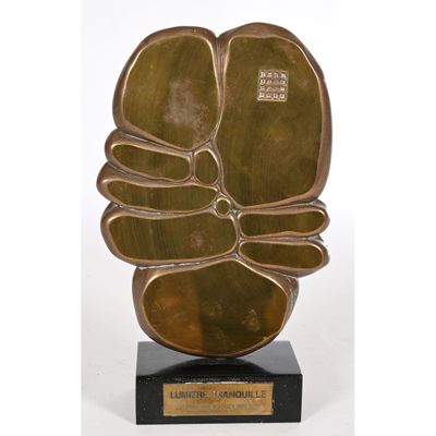a bronze sculpture of a flower on a black base