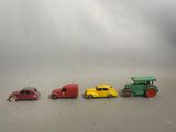 several toy cars are lined up in a row on a gray surface