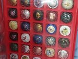 a red box filled with lots of different types of buttons