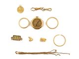 an image of a collection of gold jewelry including a watch, bracelet, ring, and other items