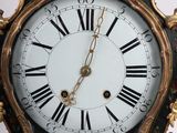 a clock that has roman numerals on the face of it