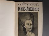 an open book with a black and white photo of a woman ' s face