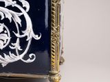 an image of a blue and white clock with a dragon on it