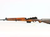 an old rifle with a wooden barrel on a white background