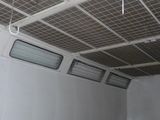 a room with a ceiling that has a lot of wires hanging from the ceiling