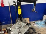 a machine that is sitting on the ground in the garage