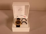 two watches in a white box on a table