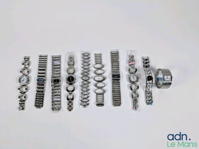 a lot of watches that are laying out on the table