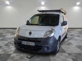 a picture of a small white van parked in a garage