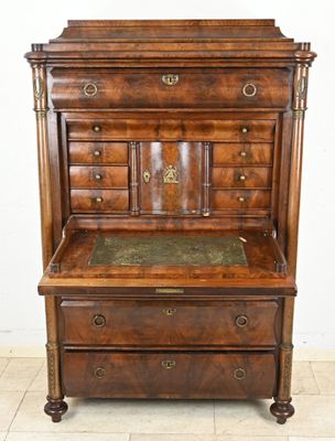 an old wooden dresser with a marble top on a tiled floor