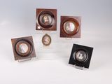 four miniature portraits of a woman and a man in a wooden frame