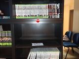 a book shelf that has a lot of books on it