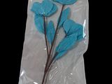a package of blue flowers on a black background