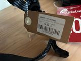 a tag that is attached to a pair of shoes on a table