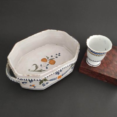 a bowl and a cup sitting on a table