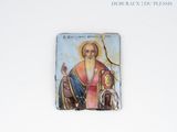 a picture of a religious icon on a white wall
