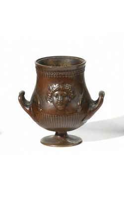 two vases sitting next to each other on a white surface
