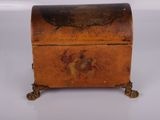 an old wooden box sitting on top of a white surface