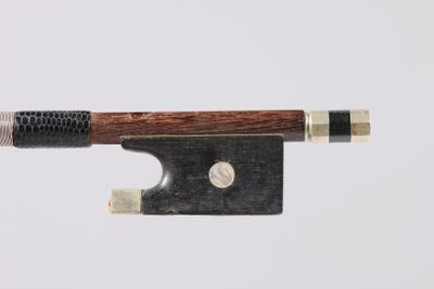 a close up of a violin bow on a white background