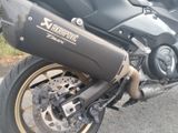 a black motorcycle parked on the side of the road