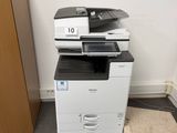 a photo of a multi - function printer in a room