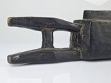 a black object that is sitting on a white surface