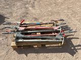 a lot of tools sitting on a pallet in the dirt