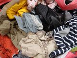 a suitcase filled with clothes and a stuffed animal