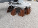 a close up of a broom with a brush on it