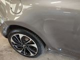 a close up of a car ' s paint job on the side of the car