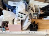 a desk with a lot of clutter on it
