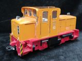 a toy train that is sitting on a black surface