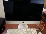 an image of a computer monitor and keyboard on a desk