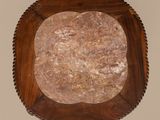 a wooden tray with a marble top on a wall