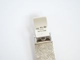 a silver buckle with a credit card attached to it