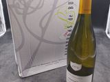 a bottle of wine sitting next to a box of wine