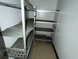 a long metal shelf in the middle of a room