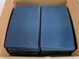 a box of blue cards in it on a table