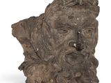 sculpture of a head of a man with a beard and a hat